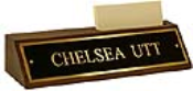 Polished brass name plates with an attractive walnut wood display base.