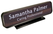 Laser engraved name plates in a variety of color options with attractive, framed display stand.