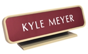 Laser engraved name plates in a variety of color options with attractive, framed display stand.
