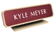Laser engraved name plates in a variety of color options with attractive, framed display stand.
