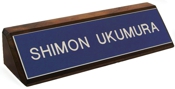 Laser engraved name plates or full color name plates with an attractive walnut wood display base.