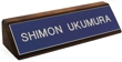 Laser engraved name plates or full color name plates with an attractive walnut wood display base.