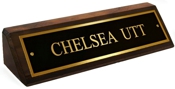 Polished brass name plates with an attractive walnut wood display base.